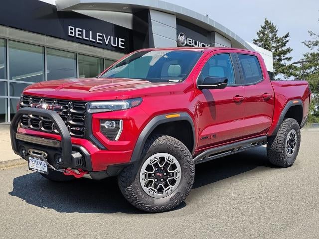 2023 GMC Canyon AT4X in Volcanic Red Tintcoat — front three-quarter view